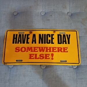 🌟3/$25🌟 novelty license plate with the text "Have A Nice Day Somewhere Else!".